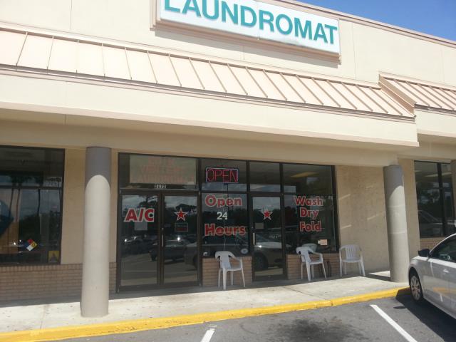Coinvenient Laundromat storefront on Main Street in Dunedin, FL